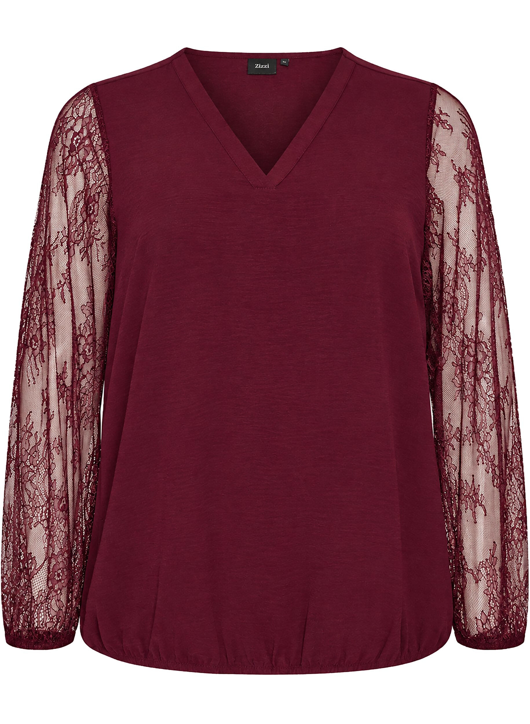 Blouse avec manches en dentelle et coupe ballon