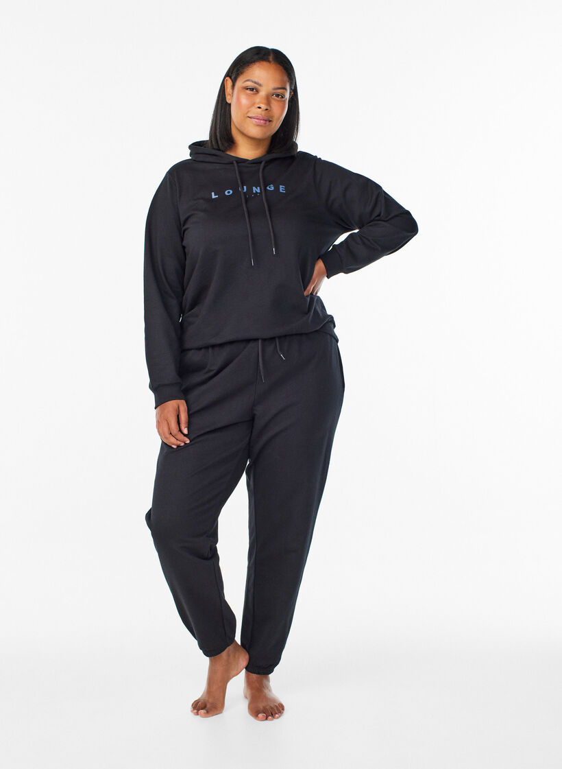 Pantalon de surv&ecirc;tement avec poches, Noir, Model image number 0