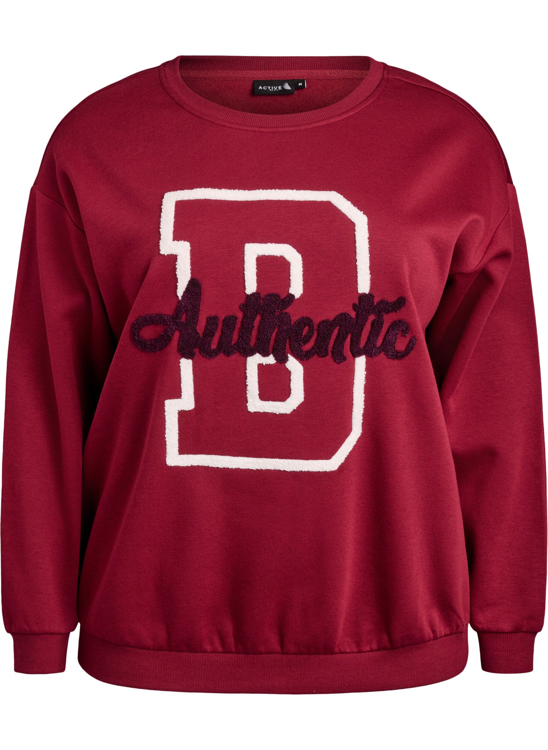 Sweat avec inscription en bouclette