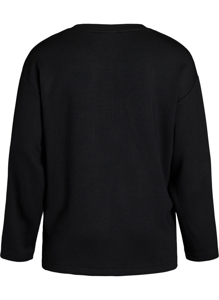 Blouse en jersey avec un volant en diagonale, Noir, Packshot image number 1