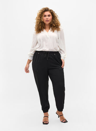 Pantalon avec poches et ourlet élastique, Black, Model image number 0