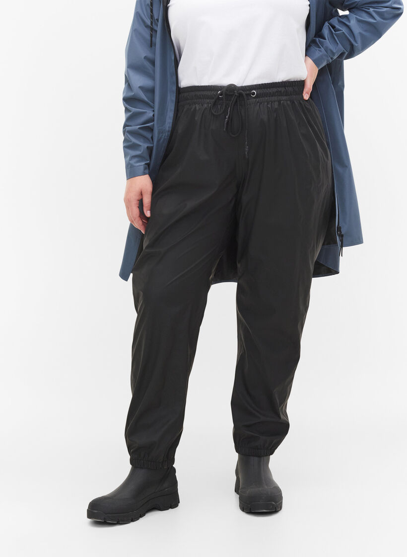 Pantalon de pluie avec élastique et cordon de serrage, Black, Model image number 2